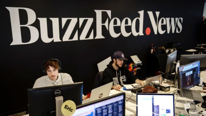 BuzzFeed News employees behind computers