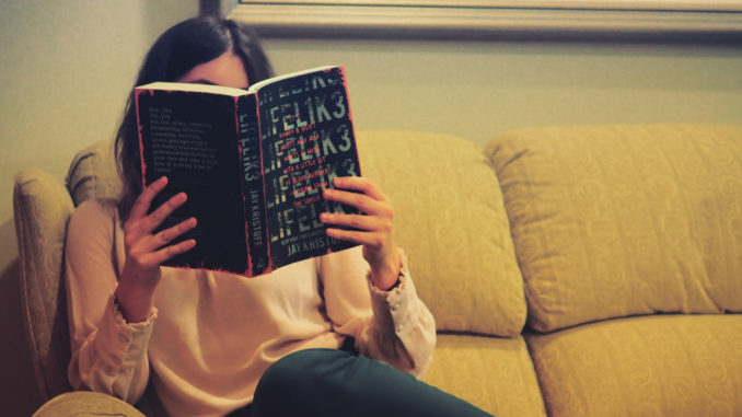 PHOTO: A reading woman.(https://www.dymocks.com.au/blog/book-news/read-australian-photo-competition)