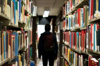 An international student walking at the library.