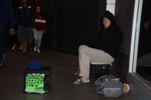 Picture of homeless man with sign asking for help