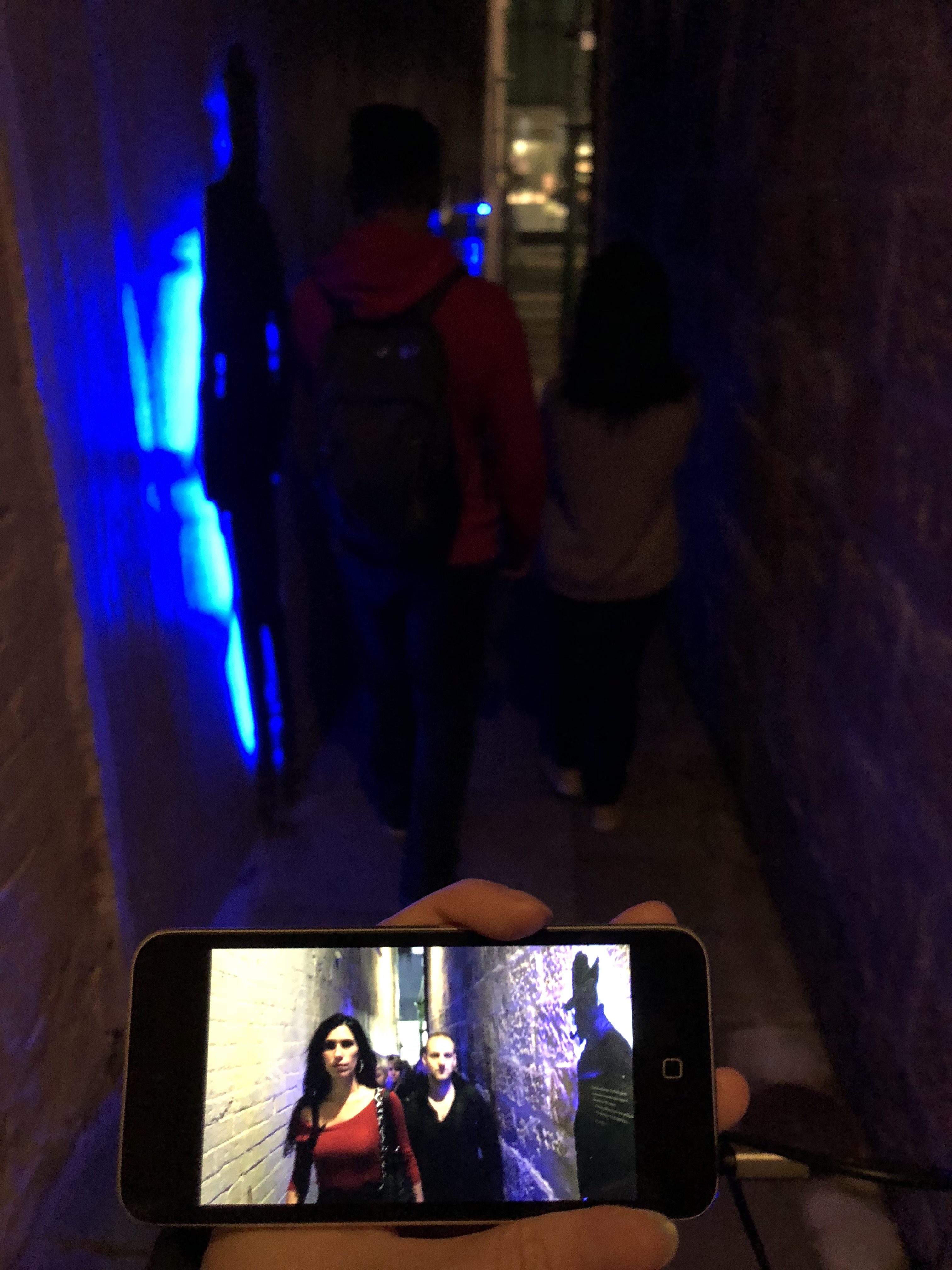 Alleyway shows people walking coldly in isolation in modern world in the video against the background of history