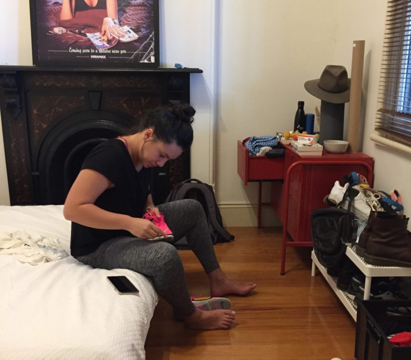 Housemate putting on running shoes