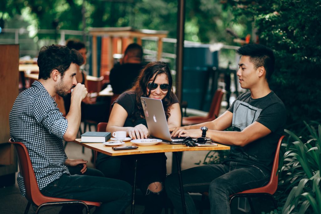 group of millennials sitting together