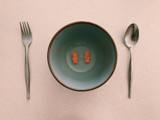 Lollies in a bowl with a spoon and fork