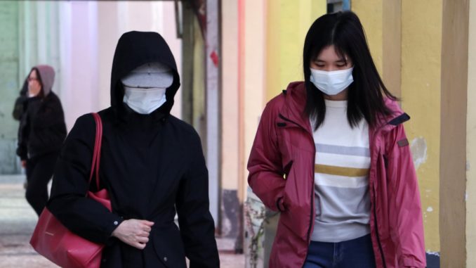 People wearing face masks to protect from coronavirus (Covid-19) in Macau, China