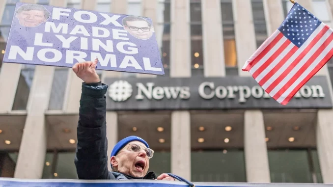 People protest outside News Corporation headquarters in New York