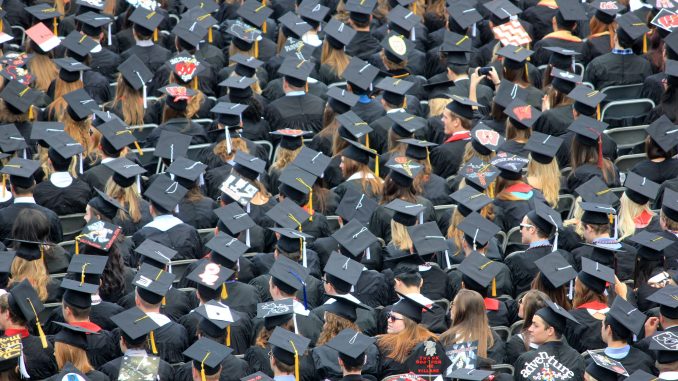 A see of college graduates at the commencement ceremony.