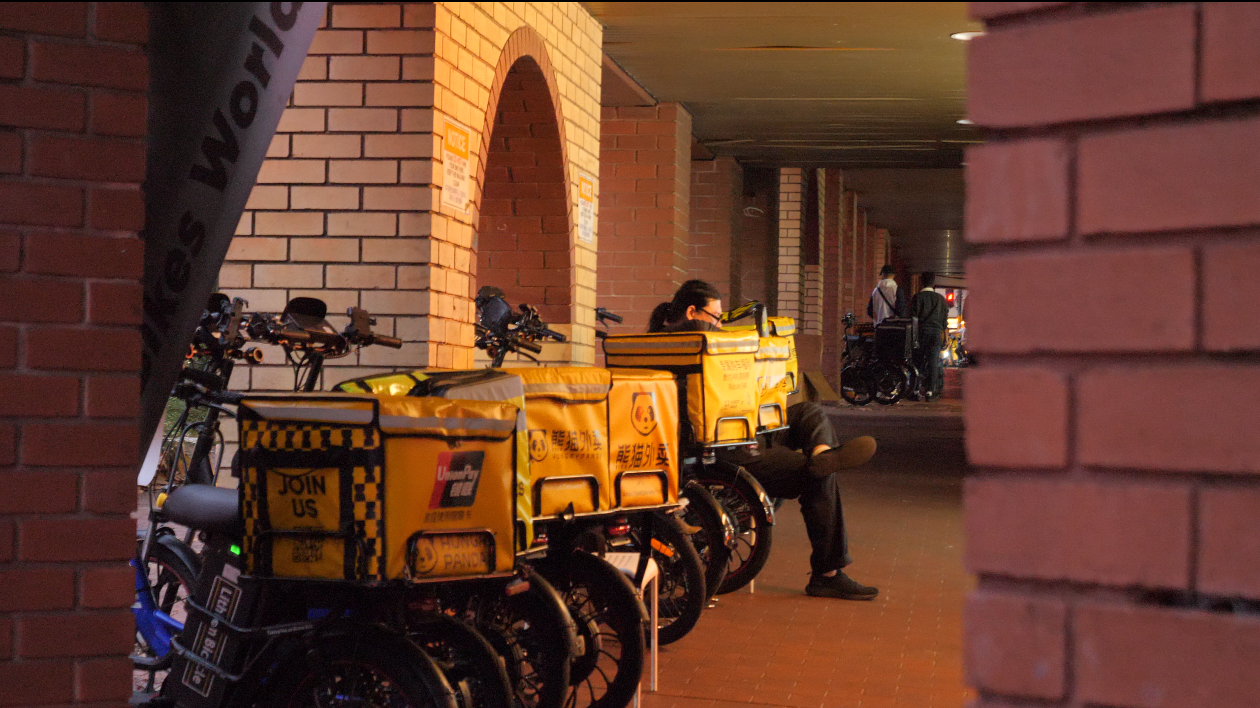 Delivery bikes lined up outside an e-bike shop. // Photo by Lyn Zhan