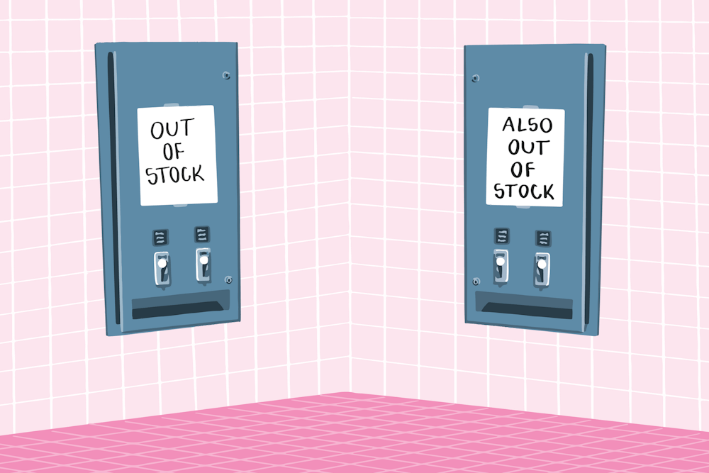 There are two free menstrual product dispensers in the school girls' toilet on a pink background. One says 'OUT OF STOCK' and the other says 'ALSO OUT OF STOCK'
