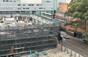 Construction site of a new residential building in Sydney, with scaffolding and demolition underway. Photo by Kate Huang.