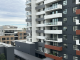 Modern apartment buildings in Sydney with balconies and mixed exterior finishes. Photo by Kate Huang.