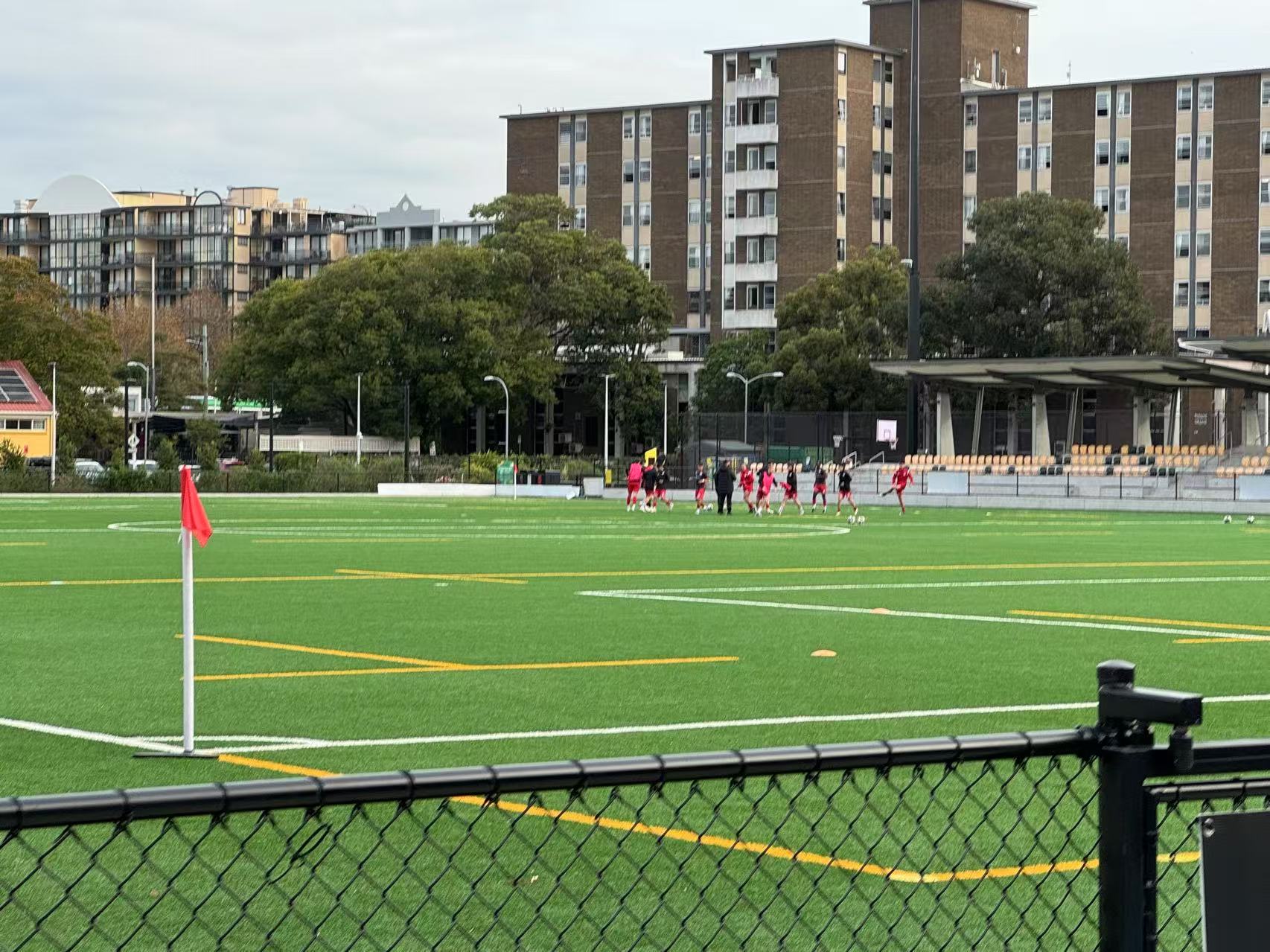 Photo shows UNSW students playing the soccer in the field