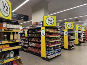 Shelf at Woolworths in Mascot, Sydney, showing marked-down grocery items.